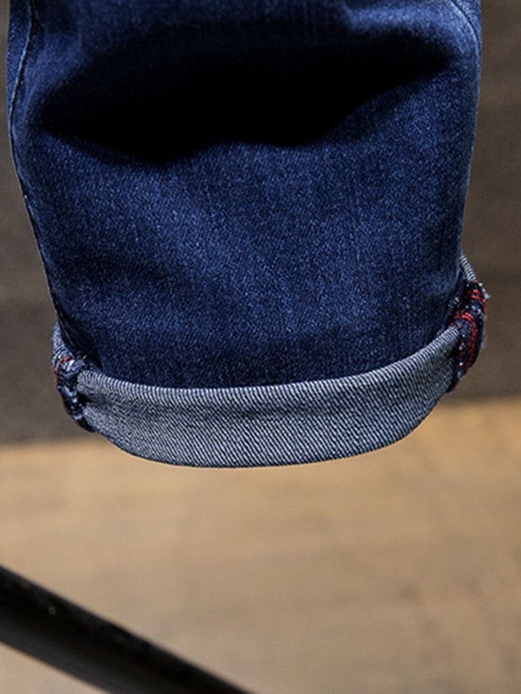 Hål Jeans Med Dragkedja I Mitten Av Midjan
