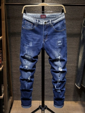 Hål Jeans Med Dragkedja I Mitten Av Midjan